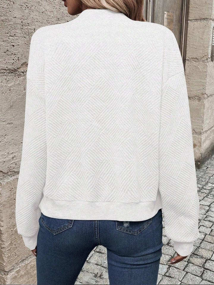 Sabine white textured bomber jacket, back view showing knit texture