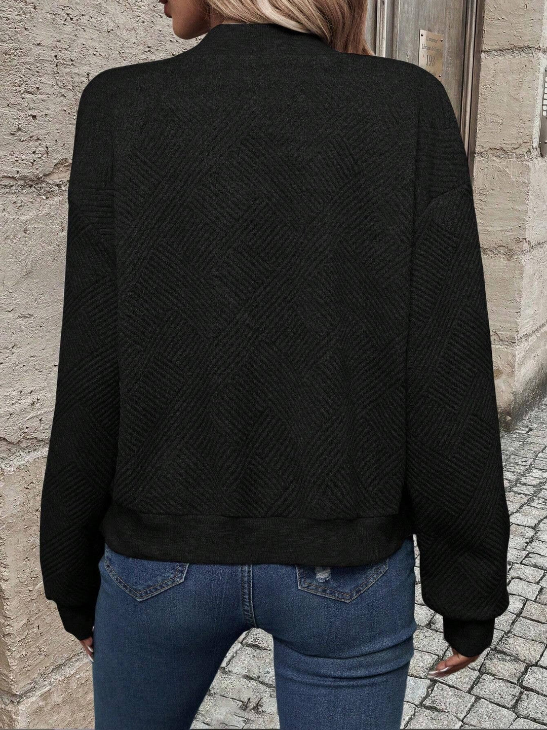 Sabine black textured bomber jacket, back view showing ribbed hem and cuffs