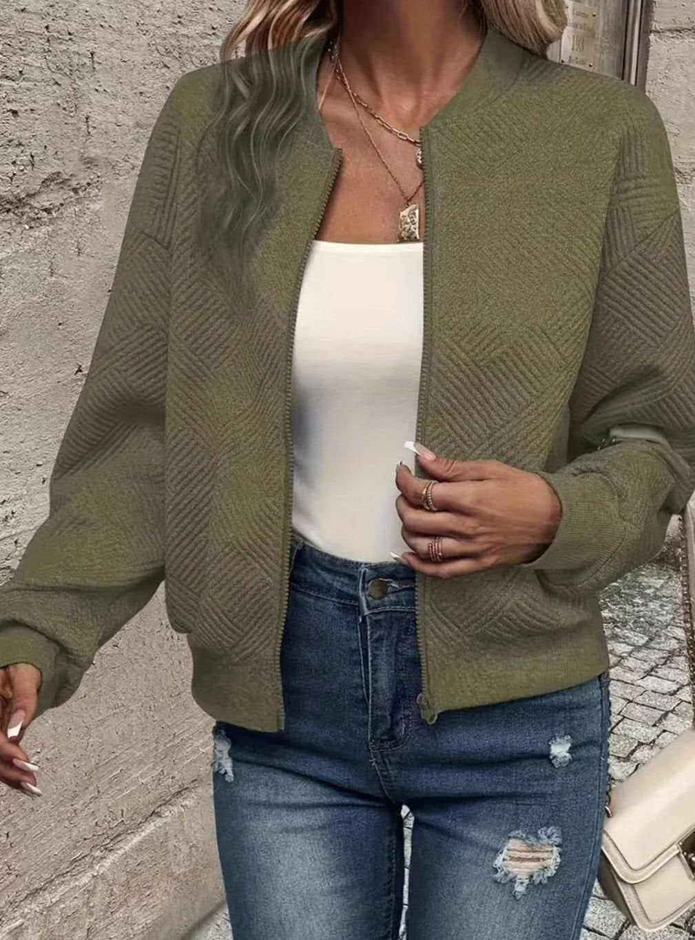 Sabine white textured knit zip-up bomber jacket, side view close-up