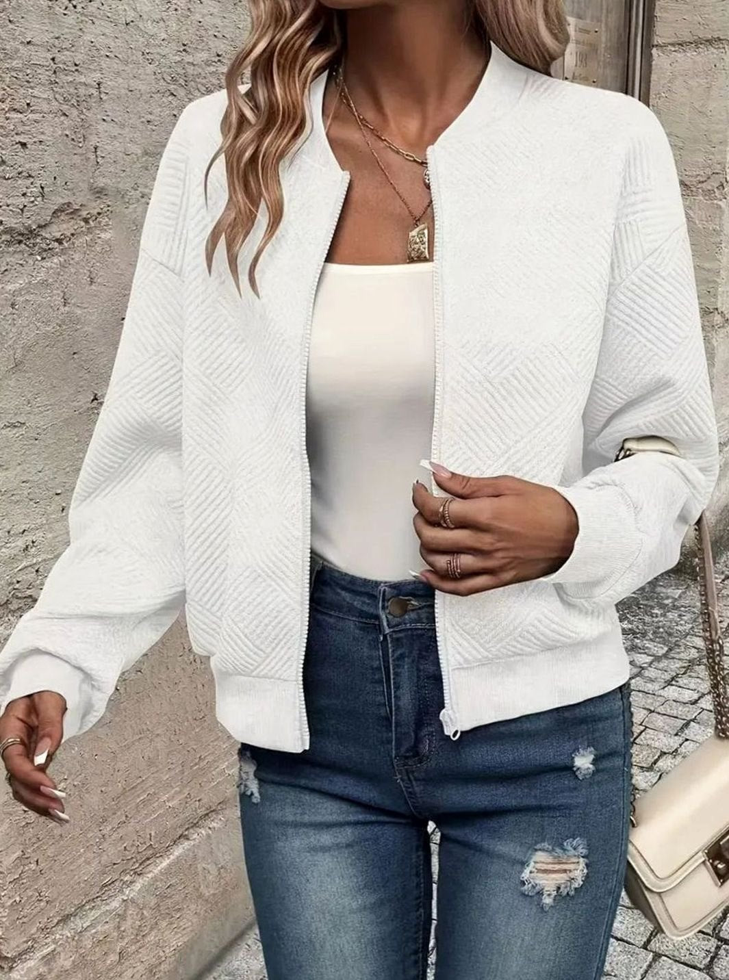 Sabine white textured knit zip-up bomber jacket, side view close-up