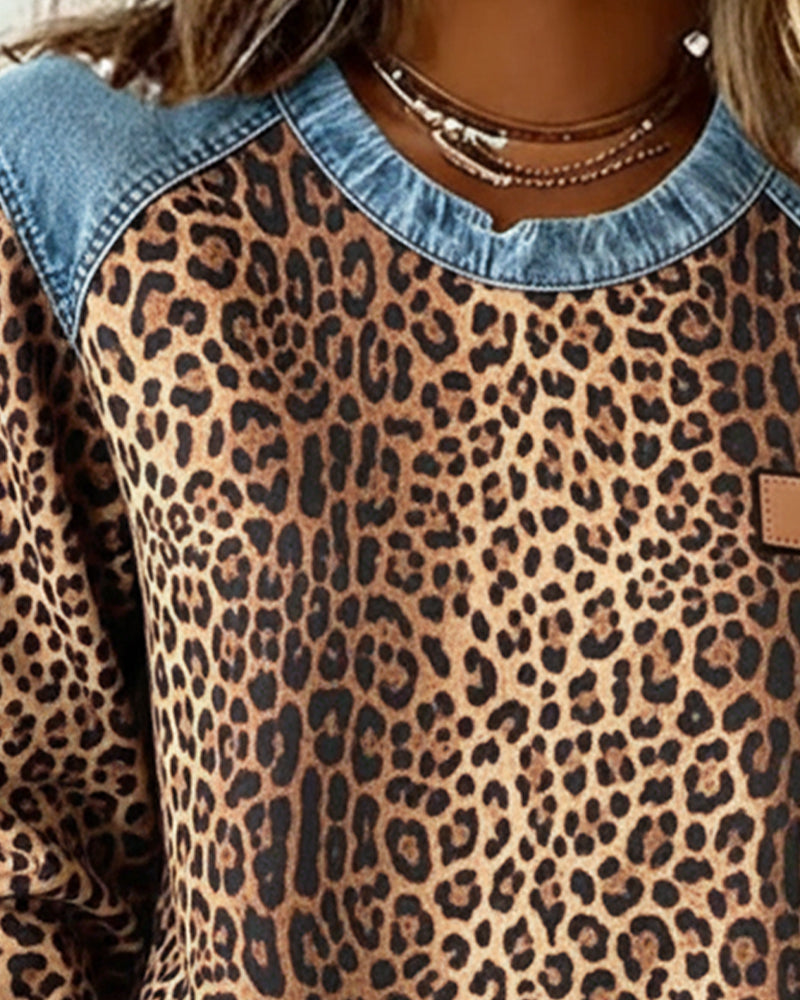 Seraphine leopard print sweatshirt, close-up neckline and shoulder detail