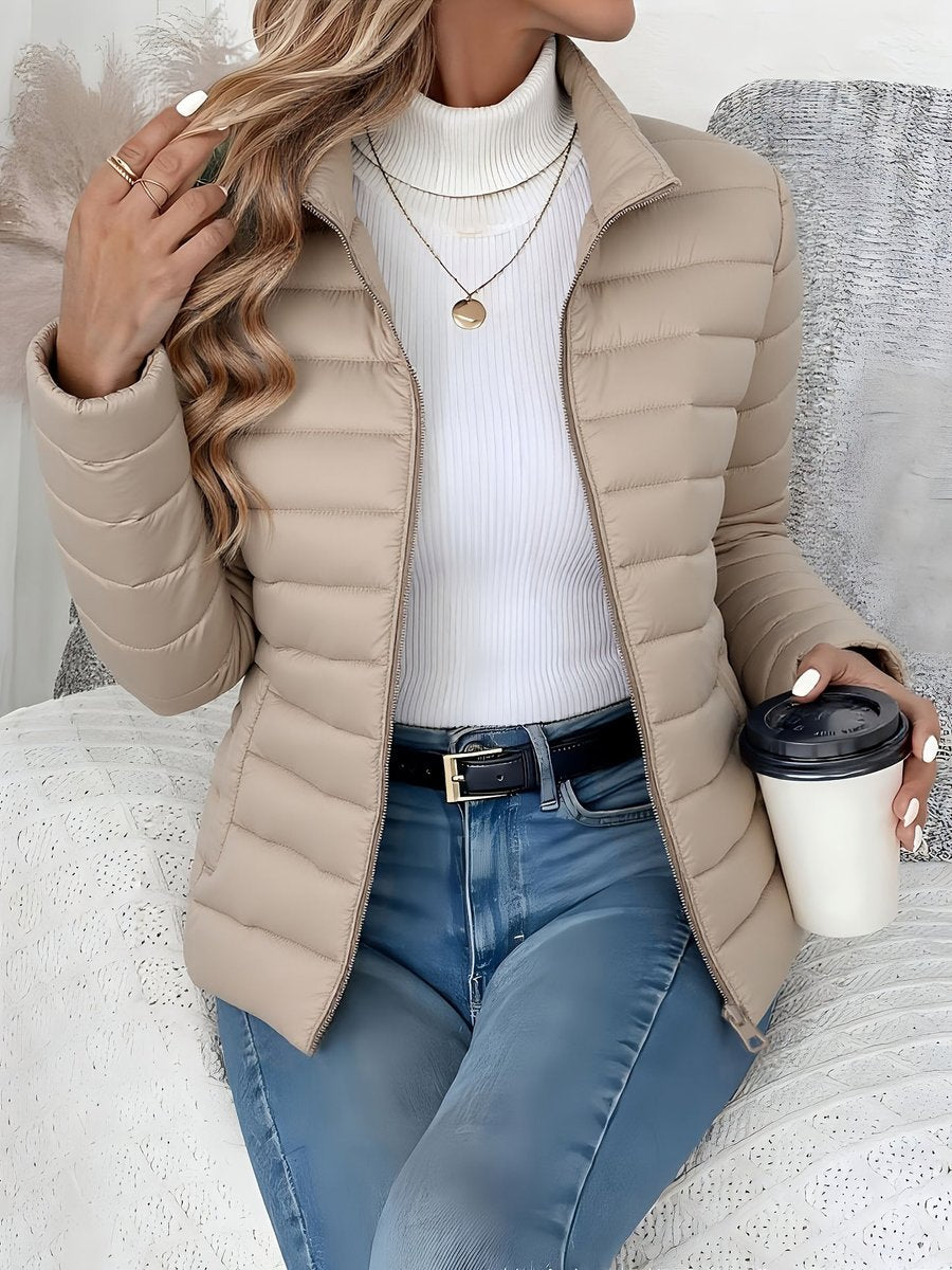 Sienna beige quilted puffer jacket, front view seated