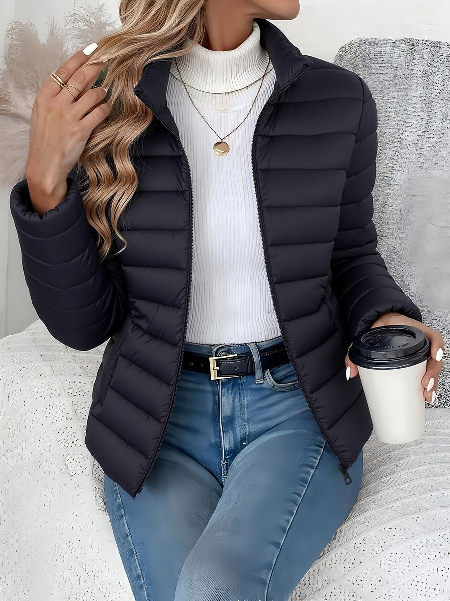 Sienna black quilted puffer jacket, front view seated