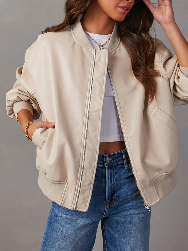 Simone oversized bomber jacket in beige, front view with hand near face