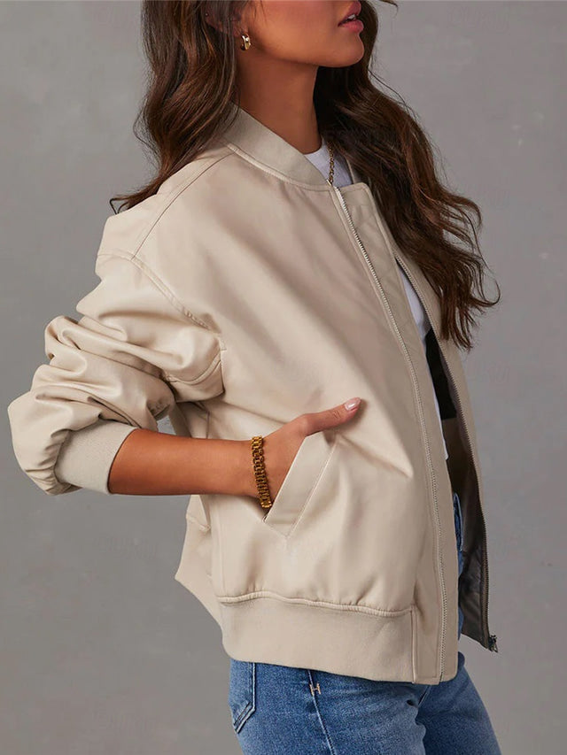 Simone beige bomber jacket, side view with hand in pocket