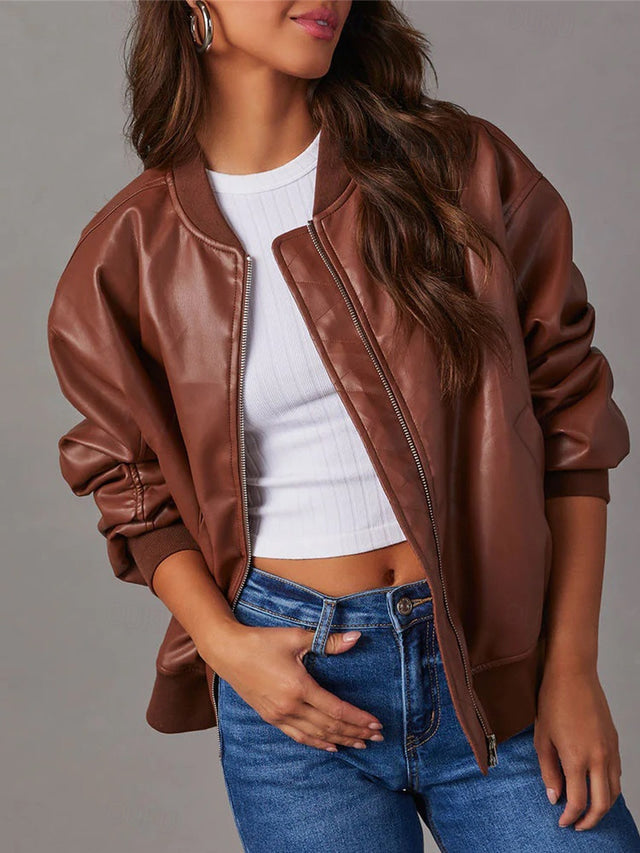 Simone brown bomber jacket, front view with hand in pocket