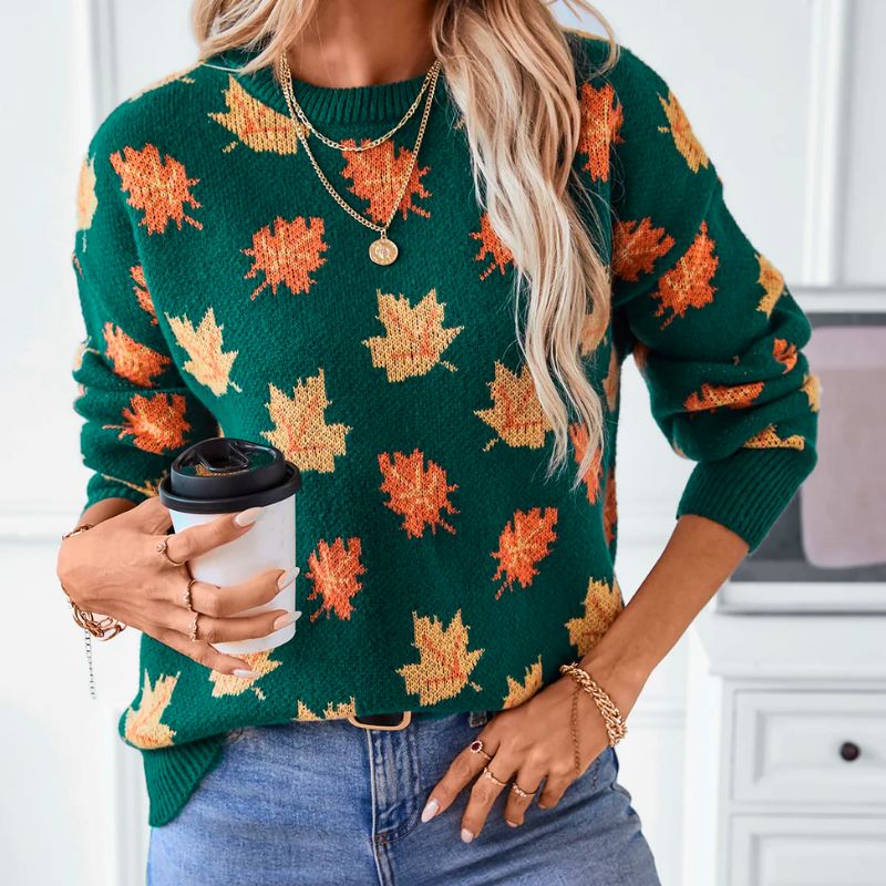 Sylvie leaf print crew neck sweater, front view holding coffee cup
