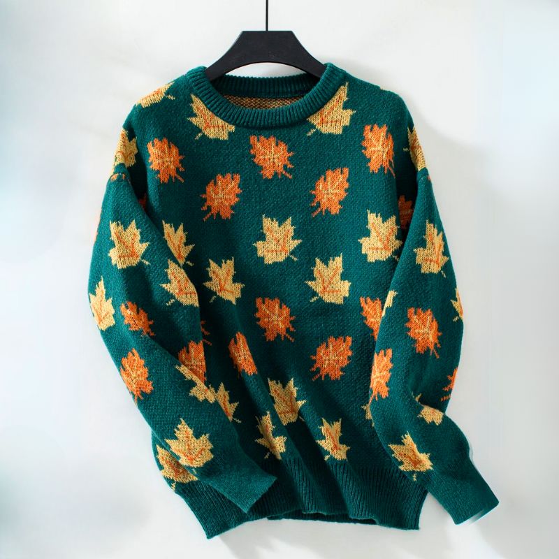 Sylvie leaf print sweater in green colorway on hanger