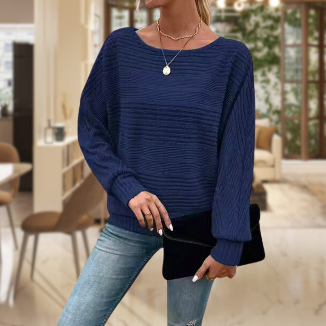 Sylvie ribbed batwing sleeve sweater in navy blue, front view with black clutch