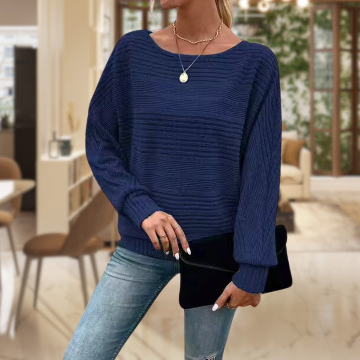 Sylvie ribbed batwing sleeve sweater in navy blue, front view with black clutch