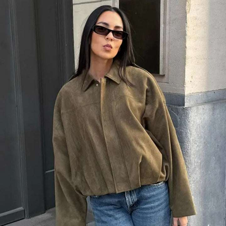 Woman wearing Talia oversized bomber jacket with sunglasses, front view