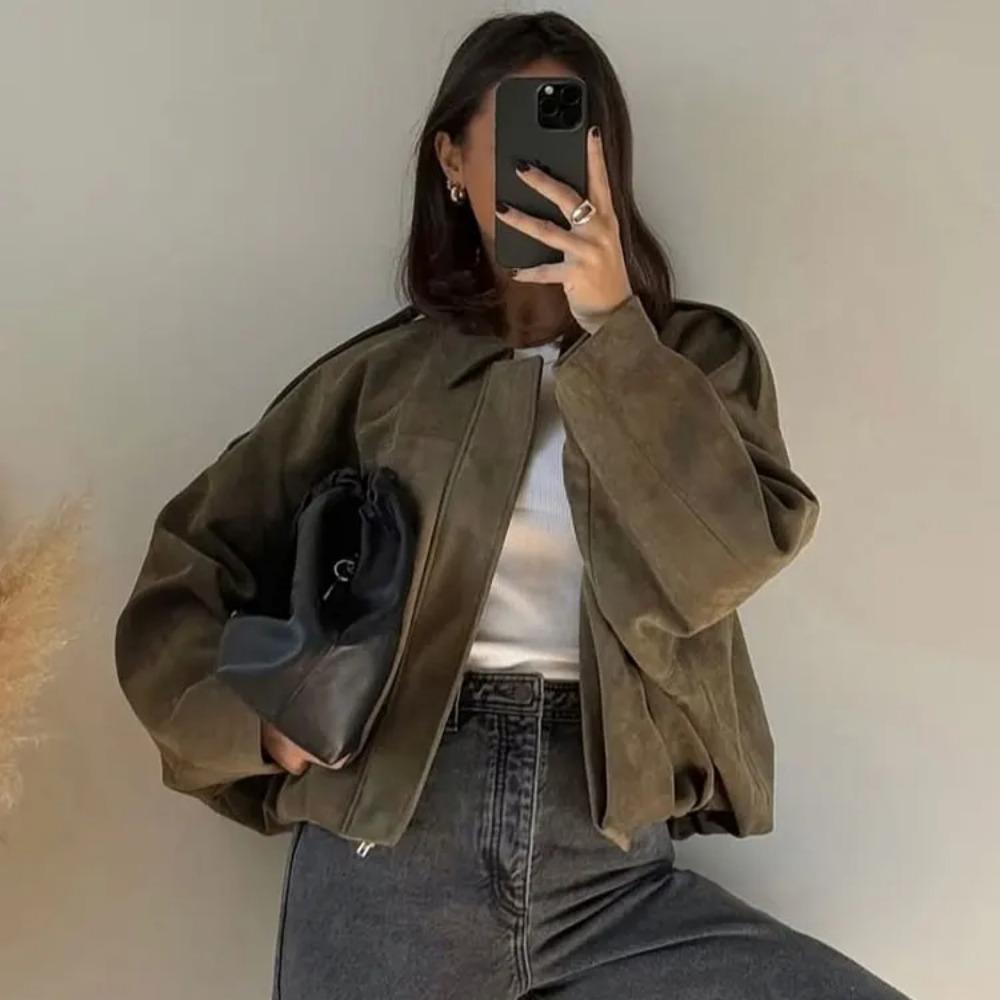 Woman wearing Talia oversized bomber jacket, close-up front detail