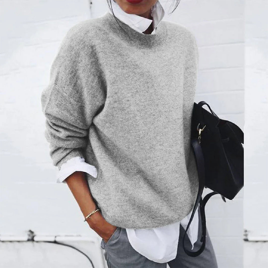 Tamsin gray mock neck knit sweater, front view with backpack