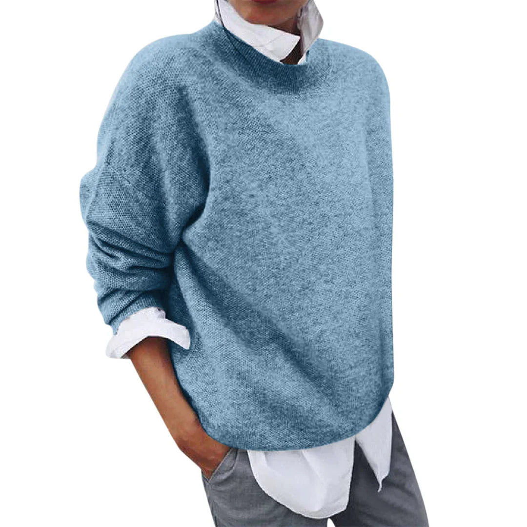 Tamsin blue mock neck knit sweater, side view layered over white shirt