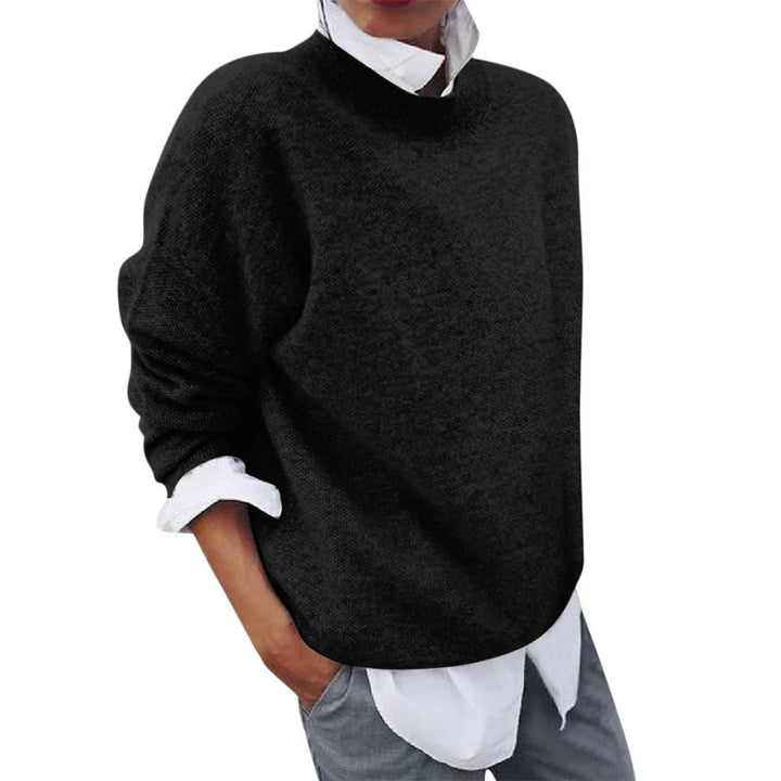Tamsin black mock neck knit sweater, side view layered over white shirt