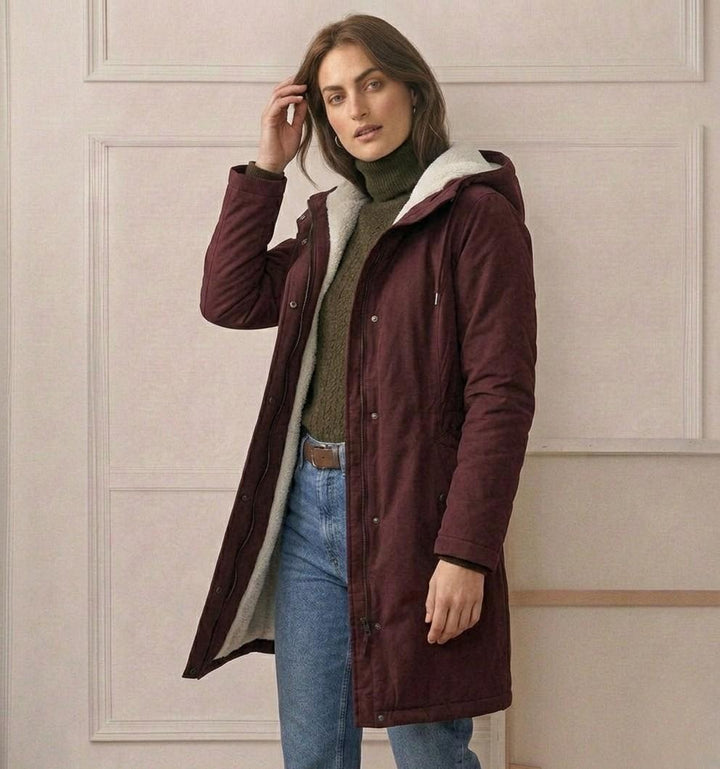 Théodora hooded fleece-lined parka in burgundy, front view on hanger