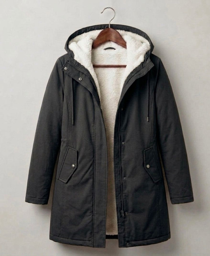 Théodora hooded fleece-lined parka in dark olive, front view on hanger