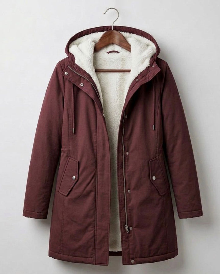 Théodora hooded fleece-lined parka in burgundy, front view on hanger