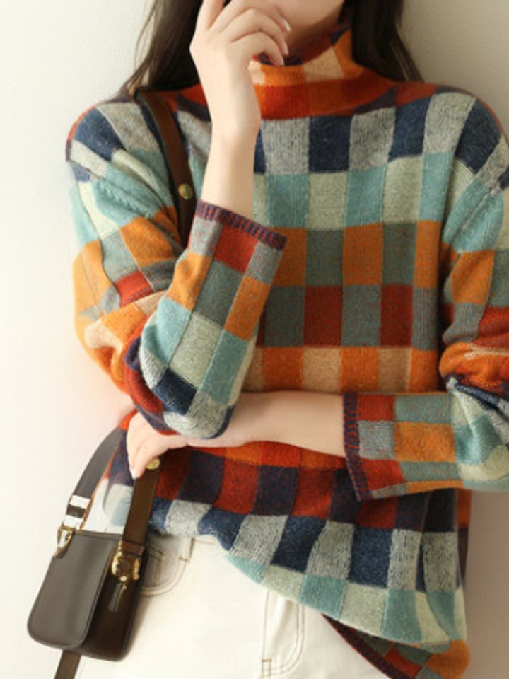 Thalia colorblock turtleneck sweater styled with crossbody bag, front view