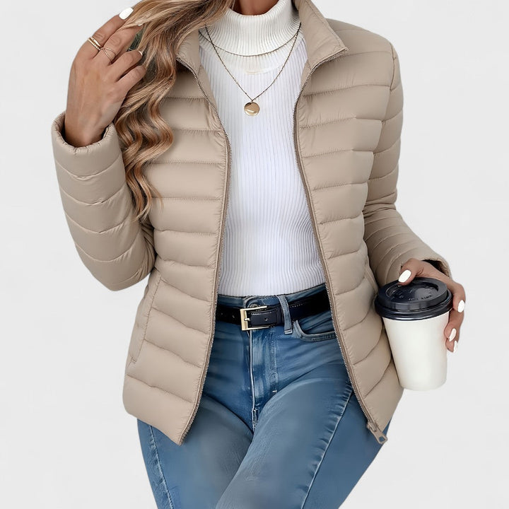 Vienna quilted puffer jacket in khaki, front view with model holding coffee