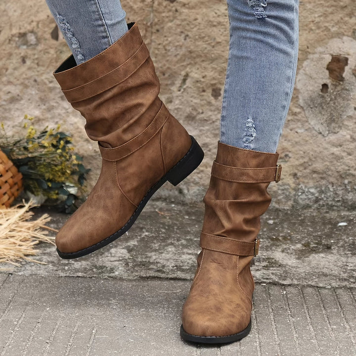 Wilhelmina slouch western boots worn with jeans, close-up side view