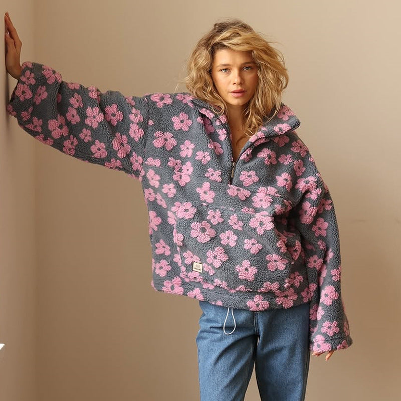 Willa pink floral fleece pullover, front view with jeans