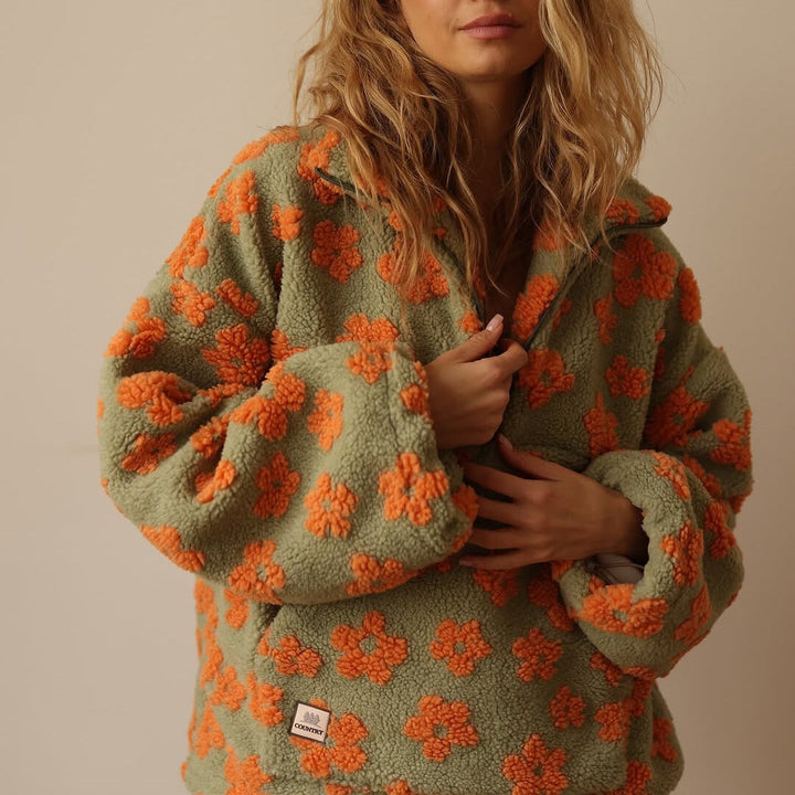 Willa orange floral fleece pullover, close-up front detail