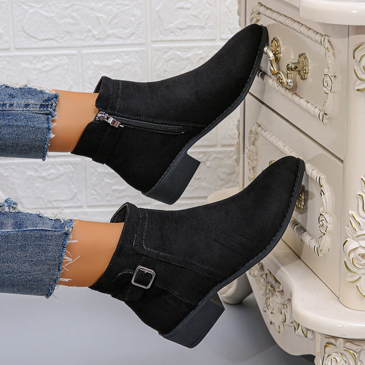 Marielle black ankle boots with buckle strap, raised view