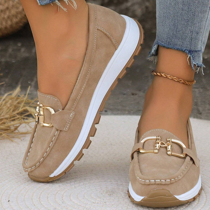 Thea buckle platform loafers styled with cropped jeans, outdoor setting