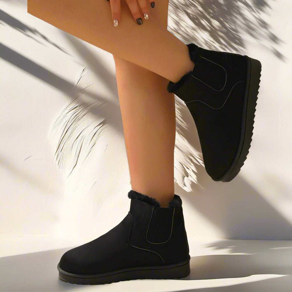 Odessa Chelsea boots in black, close-up side view on model