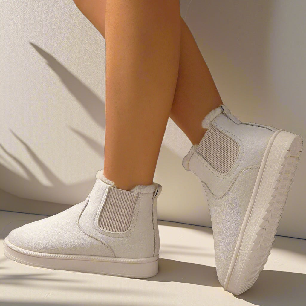 Odessa Chelsea boots in ivory, side profile on model