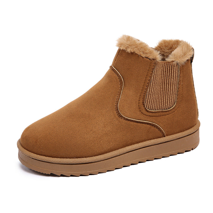 Odessa Chelsea boots in ivory, side profile on model