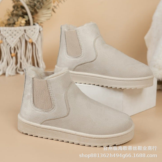 Odessa Chelsea boots in ivory, side profile on model
