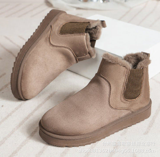 Odessa Chelsea boots in ivory, side profile on model