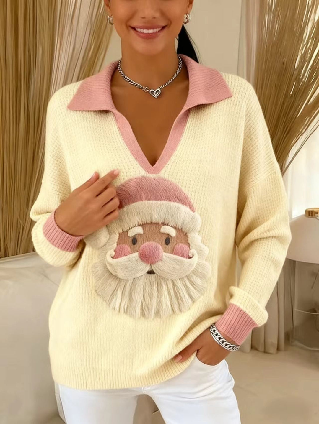 Noelani Santa print sweater styled by a fireplace with holiday decor