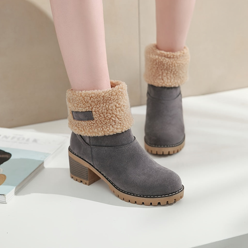 Thea cuffed block heel boots held in hand, close-up detail