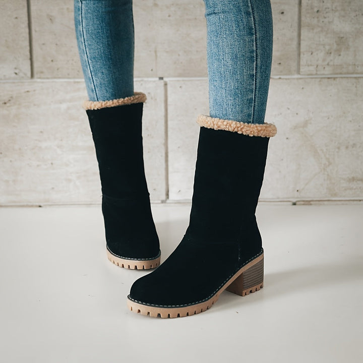 Thea cuffed block heel boots held in hand, close-up detail