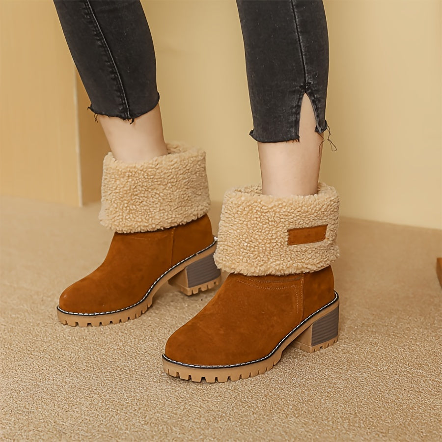 Thea cuffed block heel boots held in hand, close-up detail
