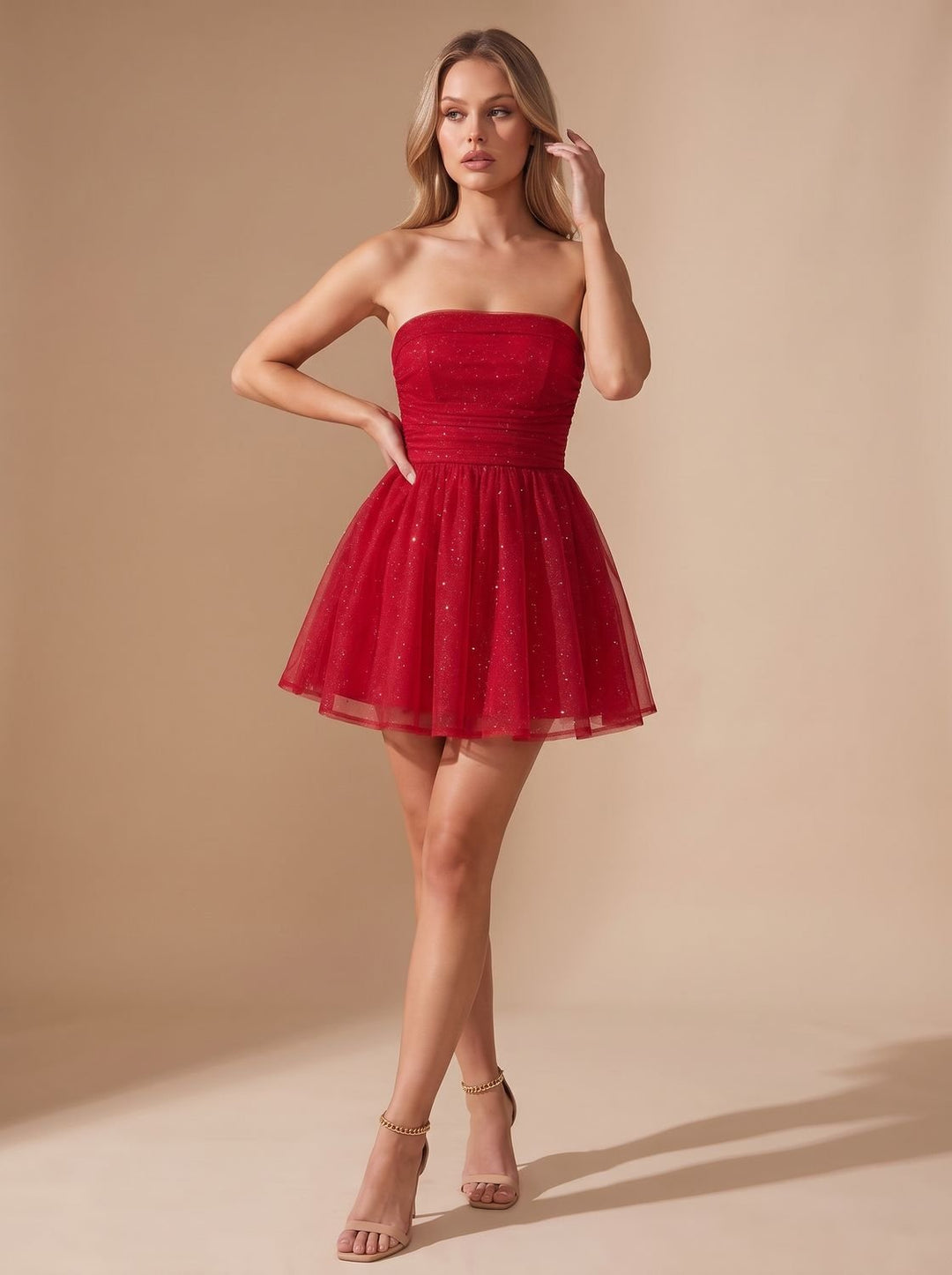 Vivienne glitter pleated bustier mini dress, back view with bow detail
