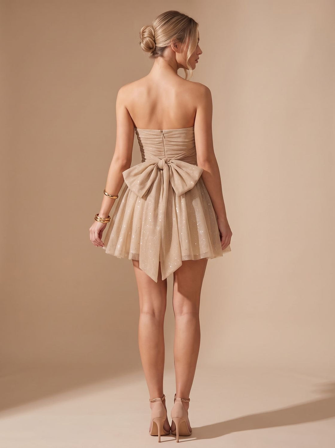 Vivienne glitter pleated bustier mini dress, back view with bow detail