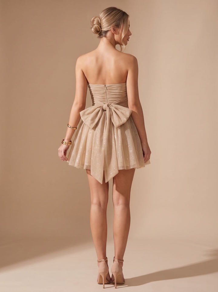 Vivienne glitter pleated bustier mini dress, back view with bow detail