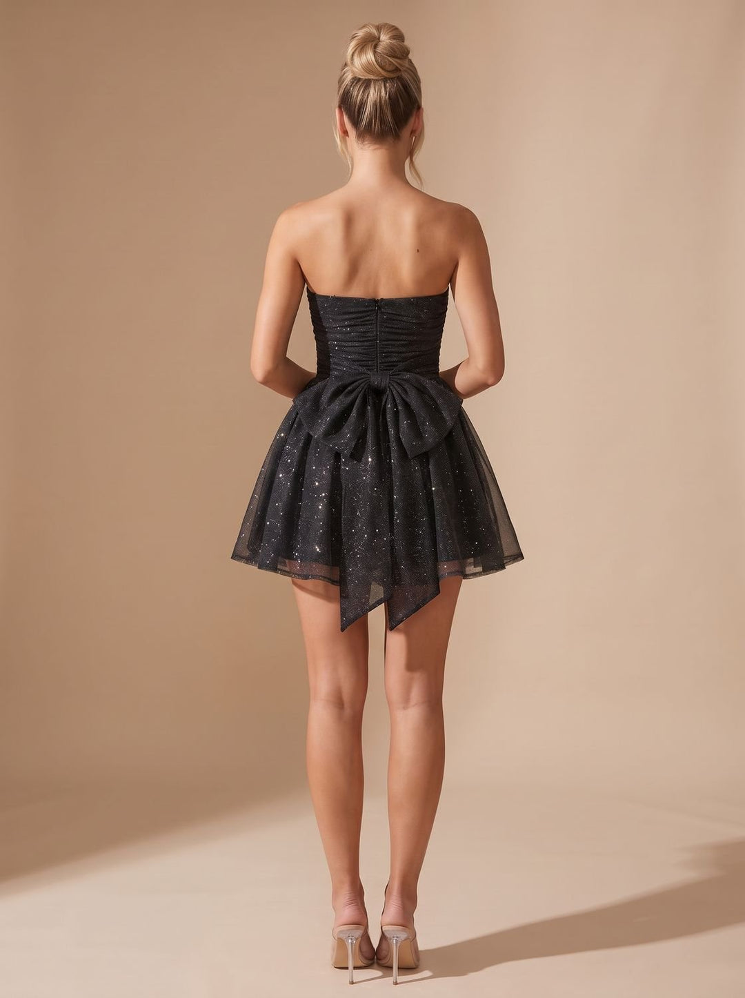 Vivienne glitter pleated bustier mini dress, back view with bow detail