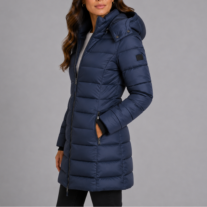 Isolde navy hooded puffer jacket, side view with hand in pocket