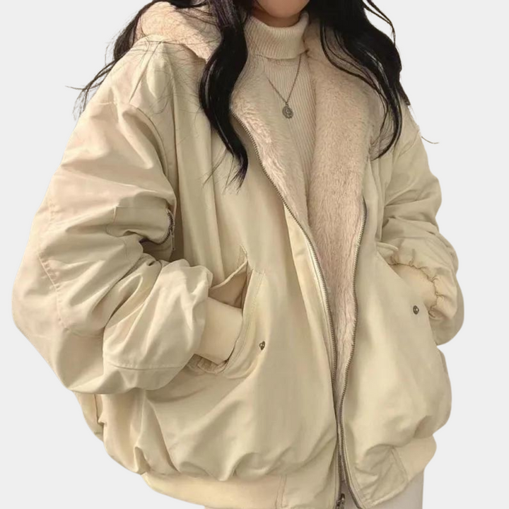 Céleste hooded oversized puffer jacket in cream, front view with hands in pockets