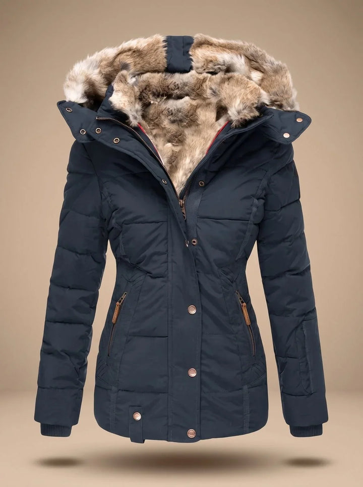 Perpetua hooded quilted puffer coat in navy blue, front view with faux-fur hood