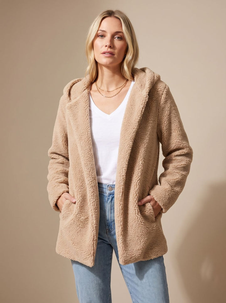 Rosalie hooded teddy fleece jacket in beige, front view with hands in pockets