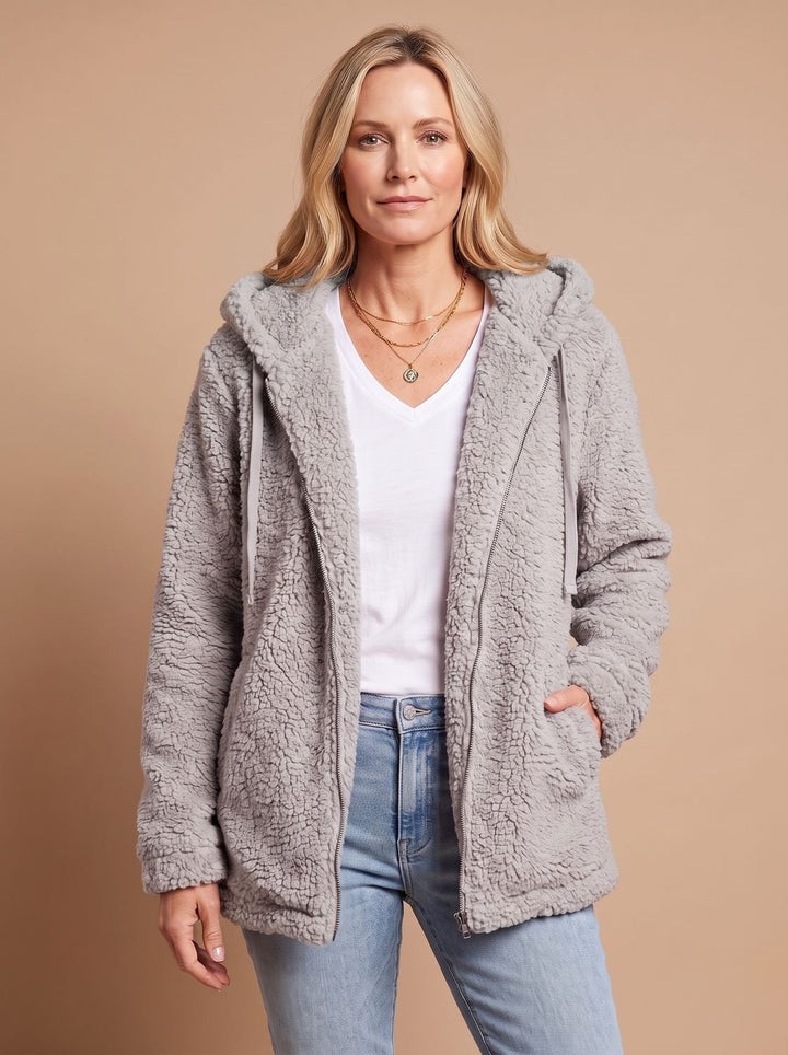 Rosalie hooded teddy fleece jacket in beige, front view with hands in pockets