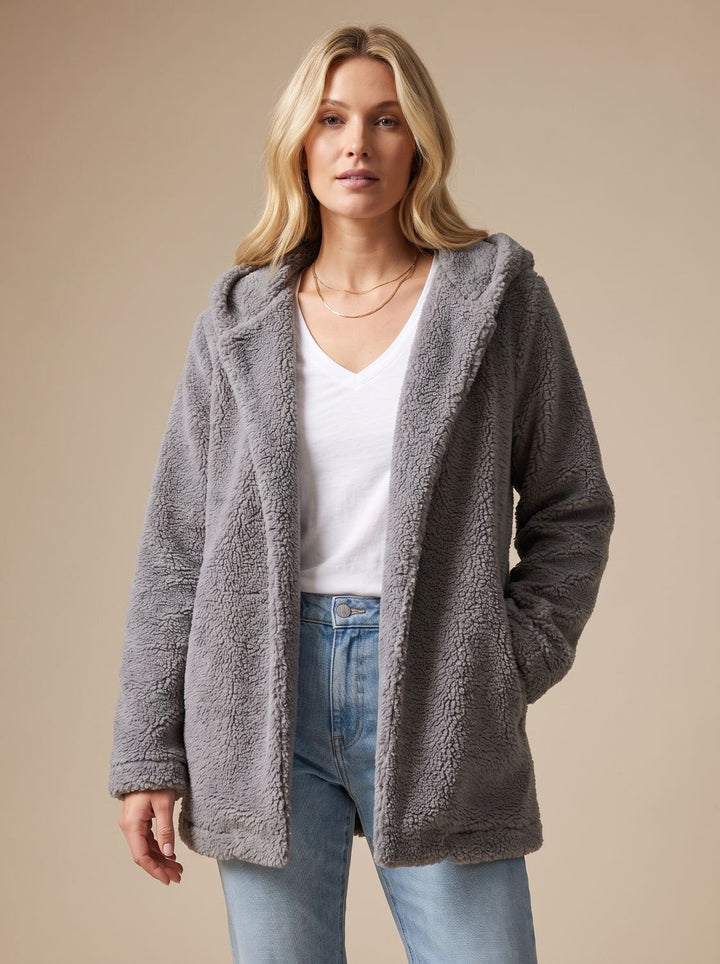 Rosalie hooded teddy fleece jacket in beige, front view with hands in pockets