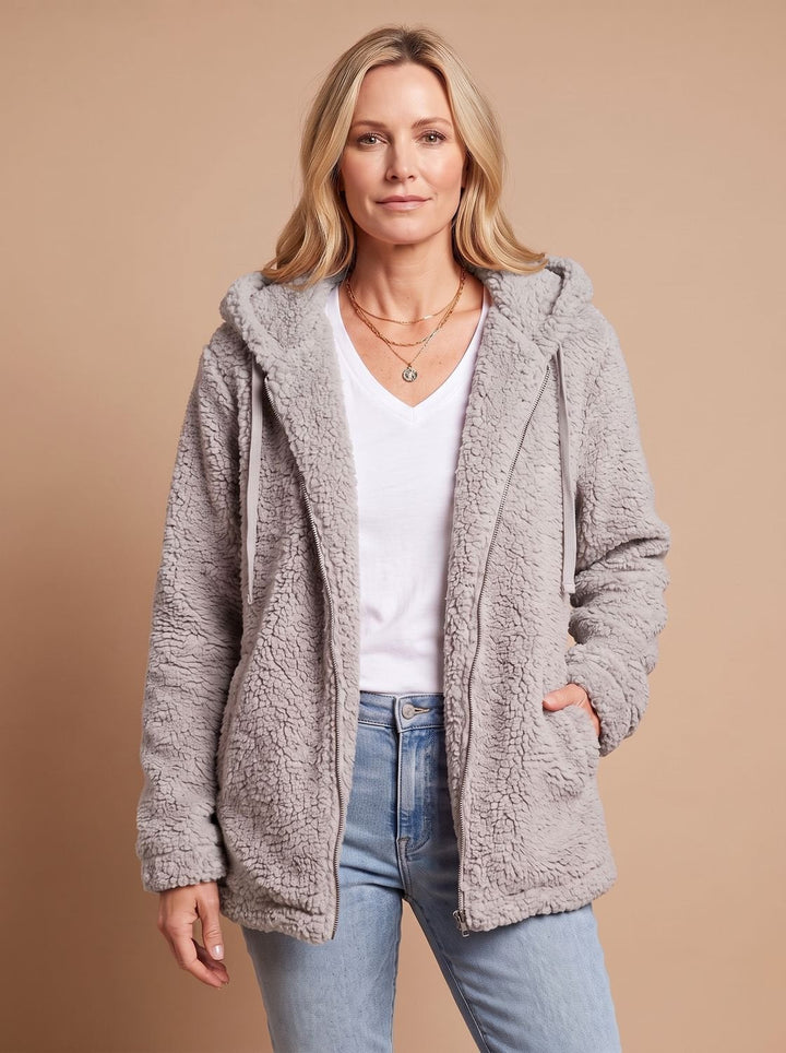 Rosalie hooded teddy fleece jacket in beige, front view with hands in pockets