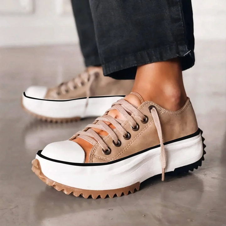 Carlotta tan platform lace-up sneakers, close-up side view with ankle pants
